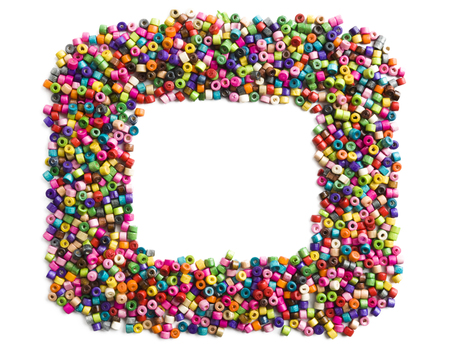 Colorful wooden beads frame on white backgroundの写真素材