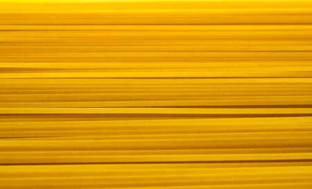 Spaghetti pasta - yellow abstract backgroundの写真素材