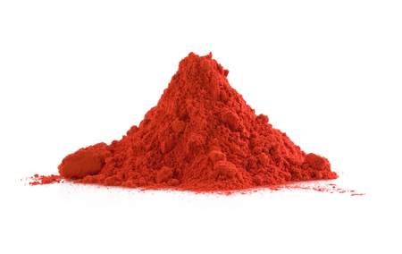 Pile of red powder isolated on white