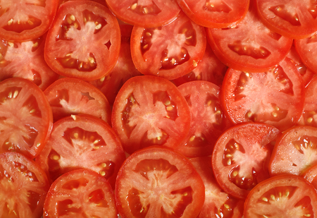 Tomato slices. Natural background with slices of tomato.の写真素材