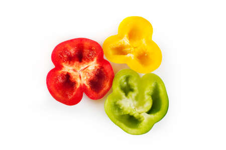 Paprika sliced isolated on white - red, yellow and green paprikaの写真素材