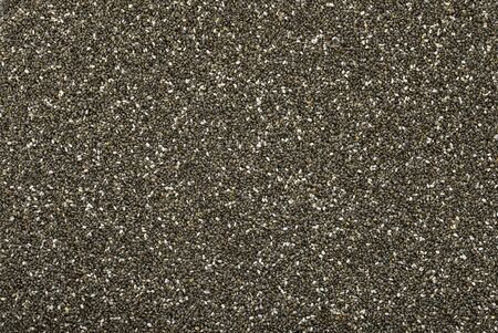 Chia seeds background. Natural pattern made by chia seeds. Flat lay. Spice texture.の写真素材