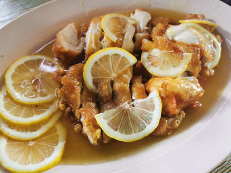 Malaysian dish of deep-fried fish with lemon and spicesの写真素材
