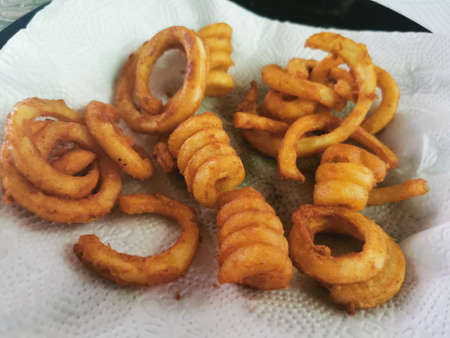 Fried onion rings on a white napkin. Close-up.の写真素材