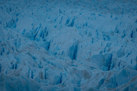 Close up on the fractured surface of a melting glacier due to global warming and climate change in Argentinaの写真素材