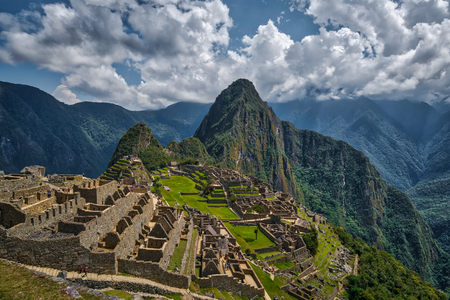 Ruins of ancient Incas city of Machu Picchu an Peruvian Andes, with Huayna Picchu. Wide angle panoramic aerial viewの写真素材
