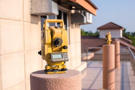 A measuring instrument sitting on top of a pole, adjusted to track the sun position during sunset and determine new moon phase.の写真素材