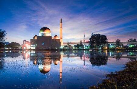 Magical sunrise at floating mosque, Masjid As Salam, Puchong with reflection on the water lake. Soft focus due to long exposure.の写真素材