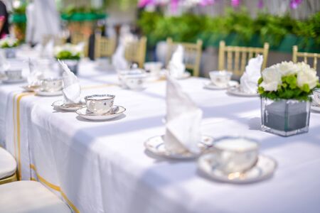 Vintage english style hi tea table decoration. Shallow DOF with selective focus on the cup.の写真素材