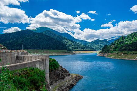 I photographed this amazing river and the white fluffy cloudsの写真素材