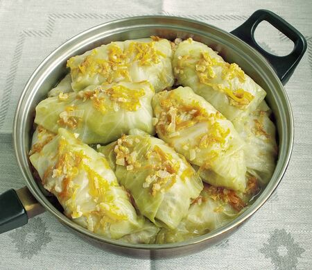 Food. Cookery. For gourmets. The cabbage with meat and carrots is fried on a frying panの写真素材