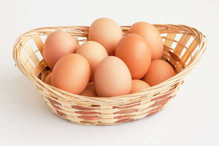 Eggs big useful brown color in a straw basketの写真素材
