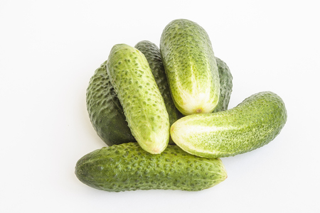 Food. Vegetables. Cucumbers of green color on a white backgroundの写真素材