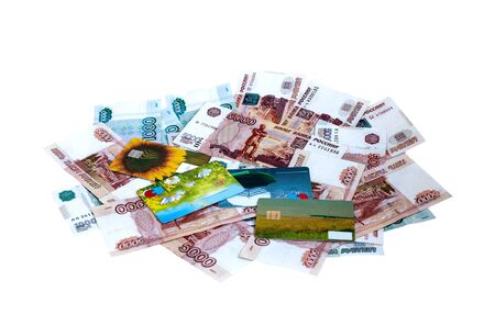 Banknotes and plastic cash cards on a white backgroundの写真素材