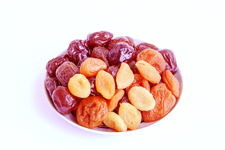 Dry apricots appetizing and useful on a white backgroundの写真素材