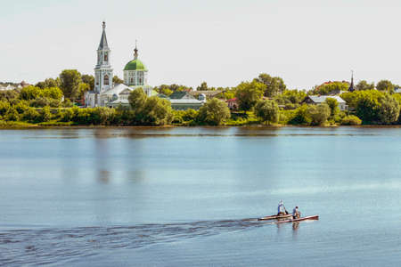 Landscape. Church ashore. The boat on the riverの写真素材