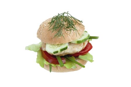 Roll with chicken cutlet and vegetables on a wooden boardの写真素材