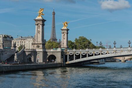 France. The bridge through the river. Tourist boat