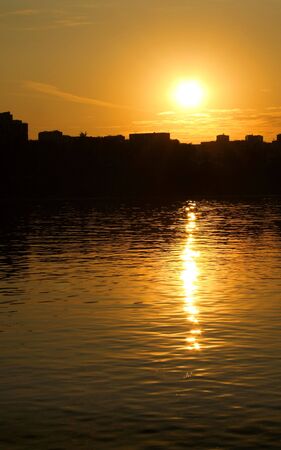 Silhouette of city in sunsetの写真素材