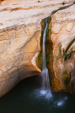 Waterfall in rocks at Tamerza of Tunisiaの写真素材