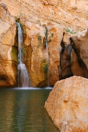 Waterfall in rocks at Tamerza of Tunisiaの写真素材