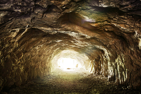 Light shining at the end of abandoned tunnel of old mineの写真素材