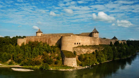 View of river and Ivangorod fortress on sunset