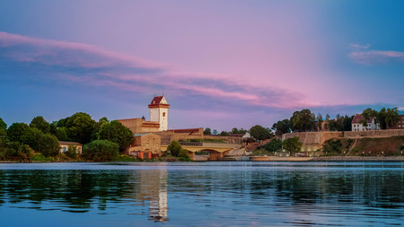 Castle of Herman on the bank of river in sunriseのeditorial素材