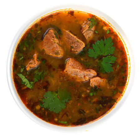 tasty goulash soup isolated on white background