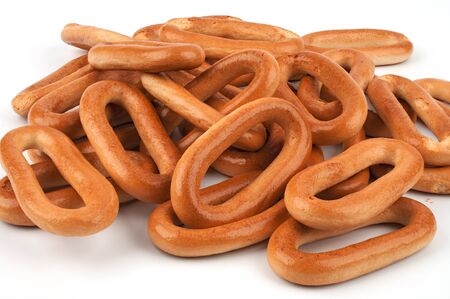A bunch of bagels on a white backgroundの写真素材