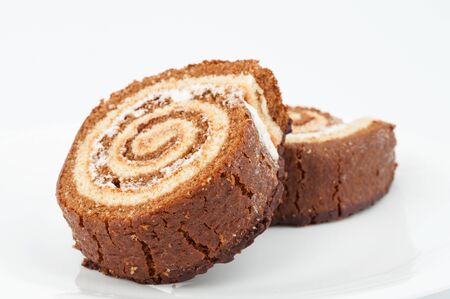 Two chocolate cake roll on white backgroundの写真素材