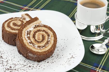 Two chocolate roll on a white plateの写真素材