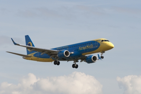 VNUKOVO, RUSSIA - SEPTEMBER 21: Aircraft operated by Aerosvit, landing in Moscow airport in Vnukovo on September 21, 2012. The company Aerosvit in its fleet has 2 aircraft Embraer E190のeditorial素材