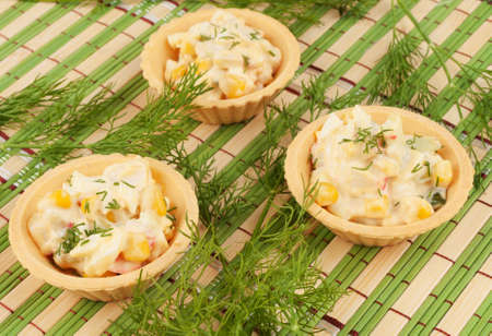 Tartlets with salad and dillの写真素材