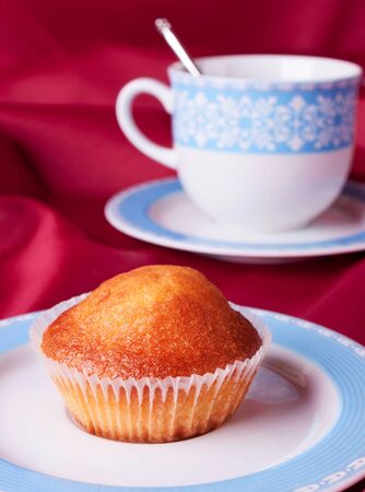Cake and a blue tea cupの写真素材
