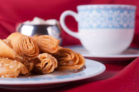 Puff pastry before blue teacup 