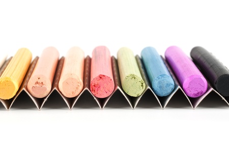 chalks in a variety of colors arranged on a white background
