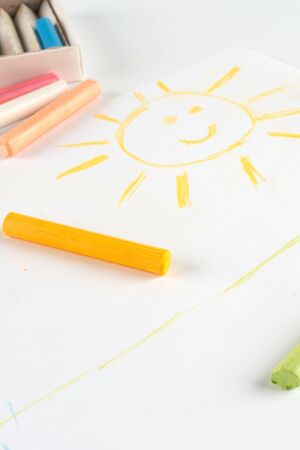 Child s drawing of a smiling sun  Done pastel on album sheet の写真素材