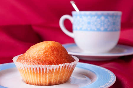 Cake and a blue tea cupの写真素材