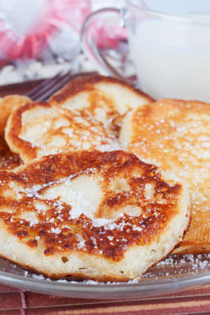 flour fritters sprinkled with sugarの写真素材