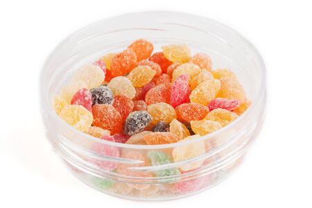 Colorful candy in a round plastic boxの写真素材