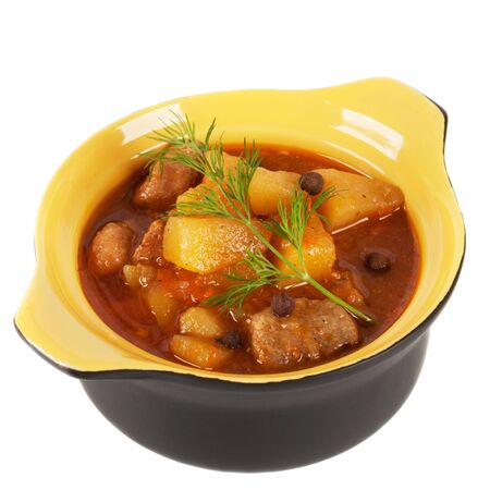 Black clay pot with braised potatoes  On a white background の写真素材