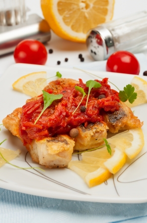 Pieces of fried fish with vegetable marinade  Closeup photo の写真素材