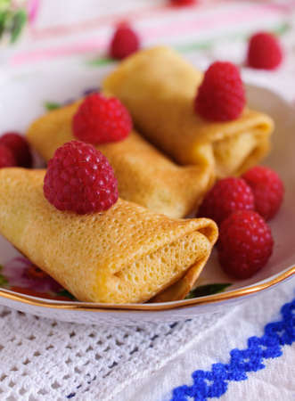 Pancakes with filling  Decorated with raspberries の写真素材