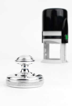 Round hand stamp on the background of automatic stampsの写真素材