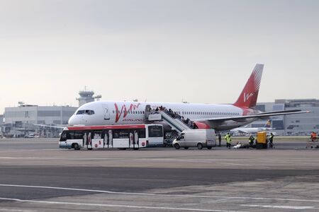 MOSCOW, RUSSIA - SEPTEMBER 26, 2014: Passengers board the aircraft Boeing 757 Vim airlinesのeditorial素材
