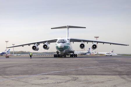 MOSCOW, RUSSIA - SEPTEMBER 26, 2014: Cargo airplane IL-76TD Alrosa airlines parked Domodedovo airport.のeditorial素材