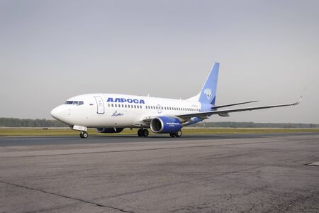 MOSCOW, RUSSIA - SEPTEMBER 26, 2014: Alrosa airlines Boeing-737 taxiing. Plane makes taxiing on taxiway Domodedovo International Airport.のeditorial素材