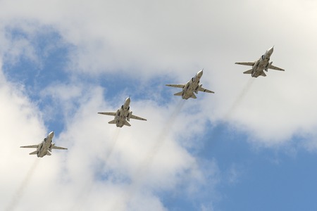 MOSCOW, RUSSIA - MAY 07, 2016: The group of Soviet bomber Sukhoi Su-24 Fencer flying over Red...