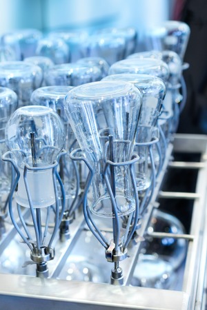 Flasks and test tubes in a tray of industrial dishwasher. Shallow depth of field Industrial background.の写真素材
